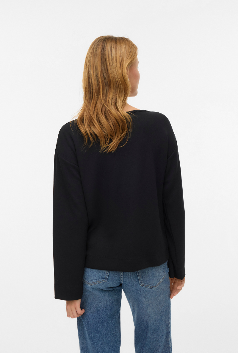 Back image of a model wearing Vero moda hali l/s boat neck top in black, by brand Vero moda