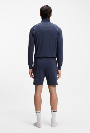 Back image of a model wearing the Boss mix & match shorts in navy, by brand Boss