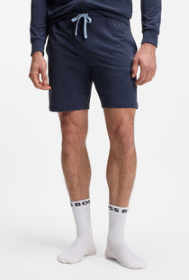 Front image of a model wearing the Boss mix & match shorts in navy, by brand Boss