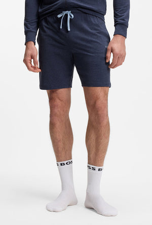 Front image of a model wearing the Boss mix & match shorts in navy, by brand Boss