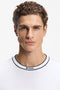Front detailed image of a model wearing the Boss tee 5 t in white, by brand Boss