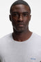 Front image of a model wearing the Mix and match t-shirt in light grey, by brand Boss