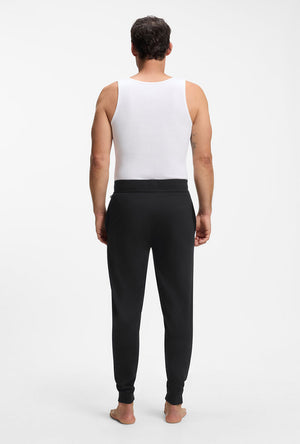 Back image of a model wearing the Authentic jogpants in black, by brand Boss