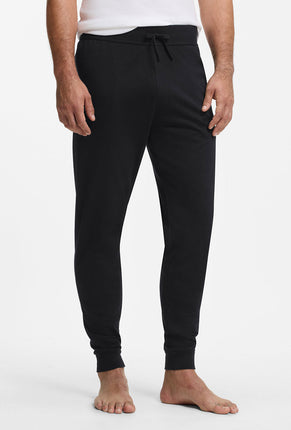 Front image of a model wearing Authentic jogpants in black, by brand Boss