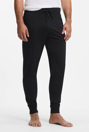 Front image of a model wearing the Authentic jogpants in black, by brand Boss