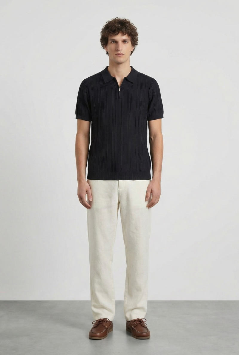 Front image of a model wearing Deep colin zip polo in black, by brand Deep