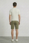 Back image of a model wearing the Deep colin zip polo in white, by brand Deep