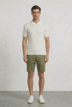 Front image of a model wearing Deep colin zip polo in white, by brand Deep