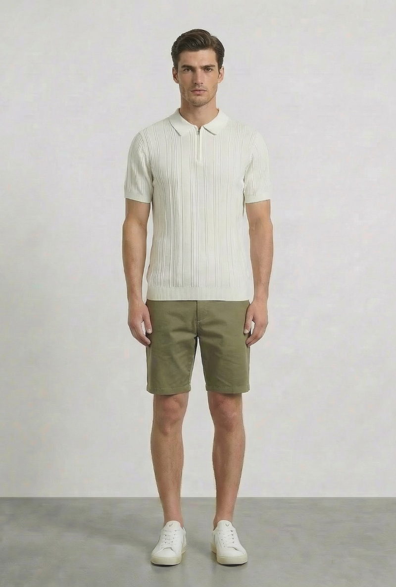 Front image of a model wearing Deep colin zip polo in white, by brand Deep