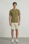 Front image of a model wearing Deep connor round neck knit in khaki, by brand Deep
