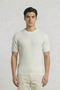 Front image of a model wearing the Deep connor round neck knit in white, by brand Deep