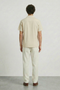 Back image of a model wearing the Deep fusion resort shirt in yellow, by brand Deep