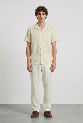 Front image of a model wearing Deep fusion resort shirt in yellow, by brand Deep