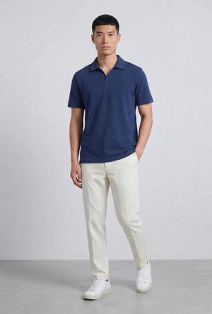 Front image of a model wearing the Deep leroy polo in navy, by brand Deep