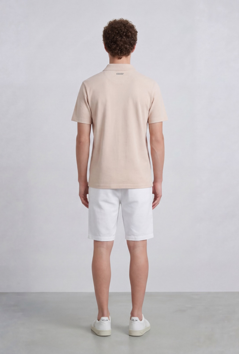 Back image of a model wearing Deep leroy polo in peach, by brand Deep