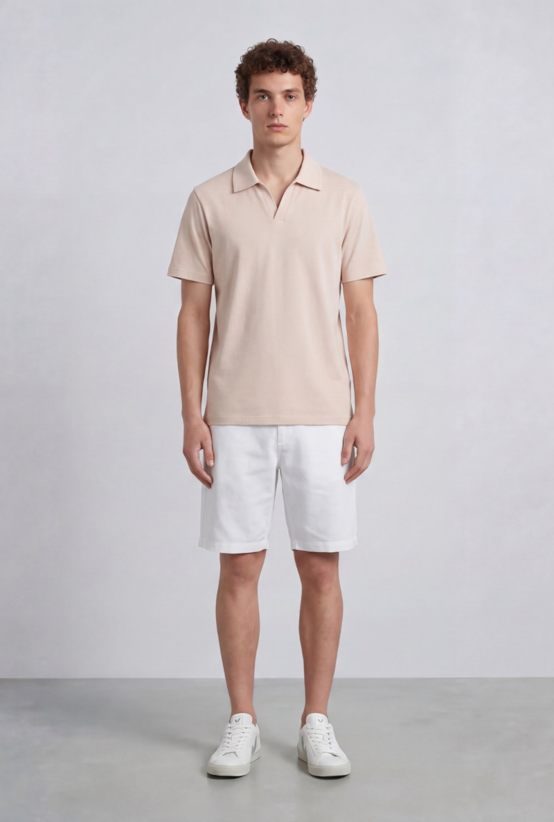 Front image of a model wearing Deep leroy polo in peach, by brand Deep