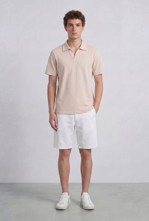 Front image of a model wearing the Deep leroy polo in peach, by brand Deep