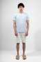 Front image of a model wearing Deep new wave cotton shorts in off white, by brand Deep