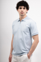 Front image of a model wearing the Deep premium polo in blue, by brand Deep
