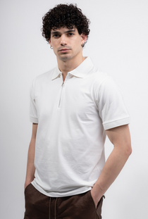 Front image of a model wearing the Deep premium polo in white, by brand Deep
