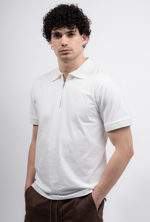 Front image of a model wearing the Deep premium polo in white, by brand Deep