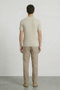 Back image of a model wearing the Deep rex crew neck rib knit in beige, by brand Deep