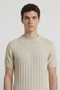 Front image of a model wearing the Deep rex crew neck rib knit in beige, by brand Deep