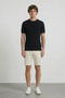 Front image of a model wearing Deep rex crew neck rib knit in black, by brand Deep