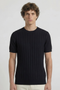 Front image of a model wearing the Deep rex crew neck rib knit in black, by brand Deep