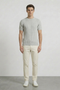 Front image of a model wearing Deep rex crew neck rib knit in light grey, by brand Deep