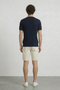 Back image of a model wearing the Deep rex crew neck rib knit in navy, by brand Deep