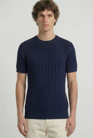 Front image of a model wearing the Deep rex crew neck rib knit in navy, by brand Deep