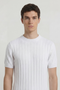 Front image of a model wearing the Deep rex crew neck rib knit in white, by brand Deep