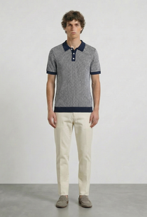Front image of a model wearing the Deep riley stripe polo in navy, by brand Deep