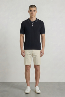Front image of a model wearing the Deep river button knit polo in black, by brand Deep
