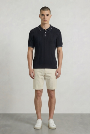 Front image of a model wearing the Deep river button knit polo in black, by brand Deep