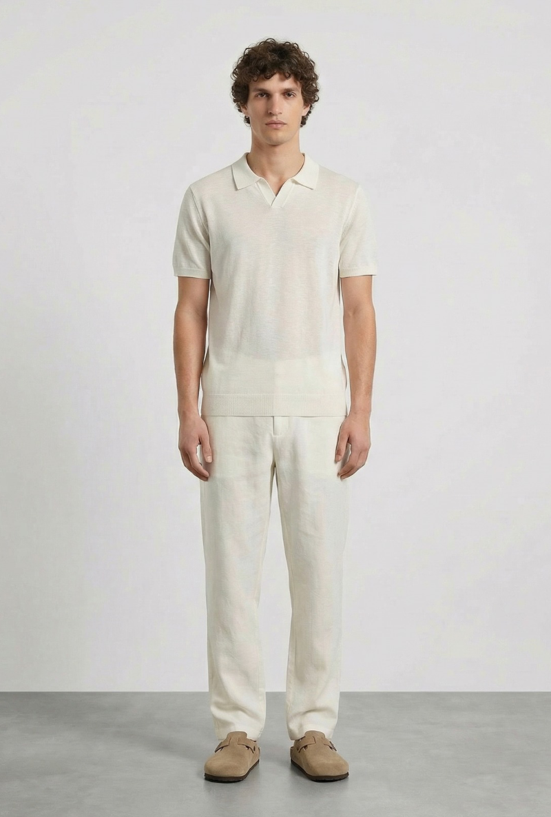 Front image of a model wearing Deep rocco open neck polo in off white, by brand Deep