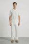 Front image of a model wearing Deep rory open neck polo in white, by brand Deep