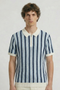 Front image of a model wearing the Deep rudy stripe knit polo in light blue, by brand Deep