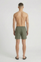 Back image of a model wearing the Deep sharky swimshorts in khaki, by brand Deep
