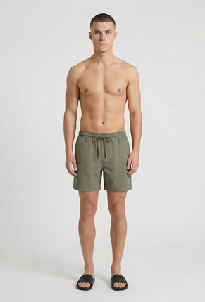 Front image of a model wearing Deep sharky swimshorts in khaki, by brand Deep