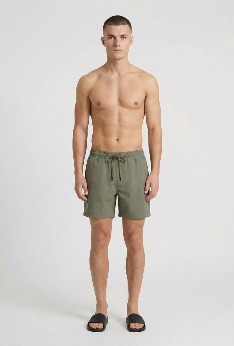 Front image of a model wearing Deep sharky swimshorts in khaki, by brand Deep