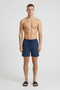 Front image of a model wearing Deep sharky swimshorts in navy, by brand Deep