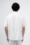 Back image of a model wearing the Deep strike linen shirt in off white, by brand Deep