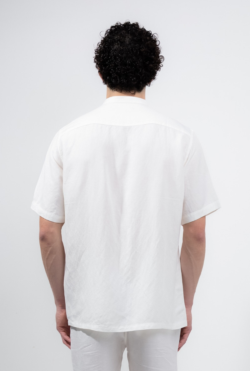 Back image of a model wearing Deep strike linen shirt in off white, by brand Deep