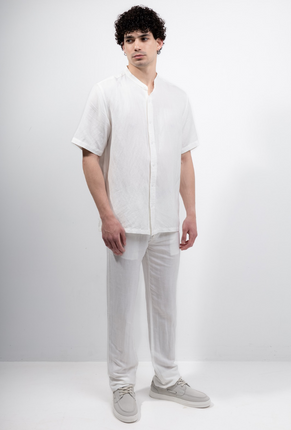 Front image of a model wearing Deep strike linen shirt in off white, by brand Deep