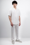 Front image of a model wearing Deep strike linen shirt in off white, by brand Deep