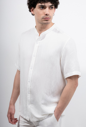 Front image of a model wearing the Deep strike linen shirt in off white, by brand Deep