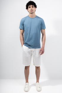 Front image of a model wearing the Deep troy tshirt in denim, by brand Deep