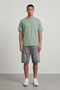 Front image of a model wearing Deep troy s/s tshirt in khaki, by brand Deep
